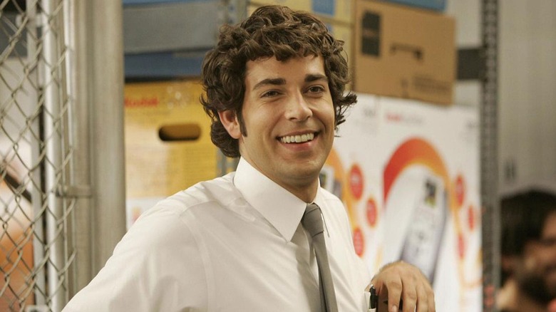 Zachary Levi as Chuck Bartowski laughs in Chuck