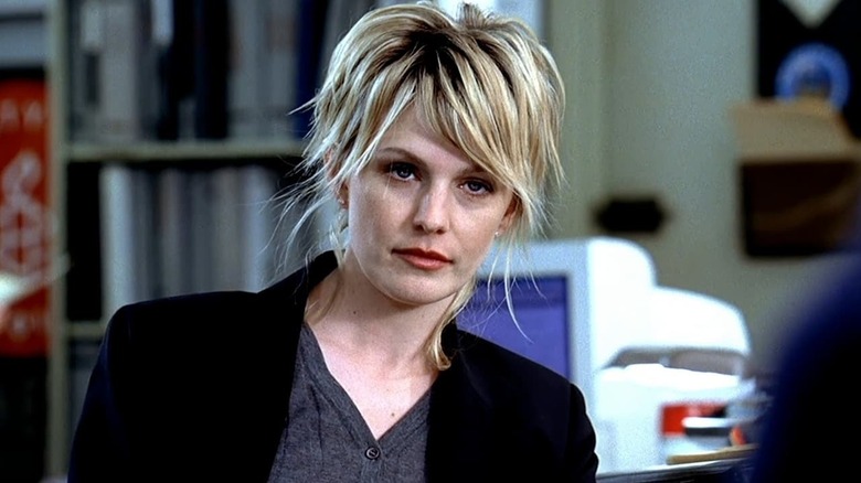 Kathryn Morris as Detective Lilly Ross sits in an office in Cold Case
