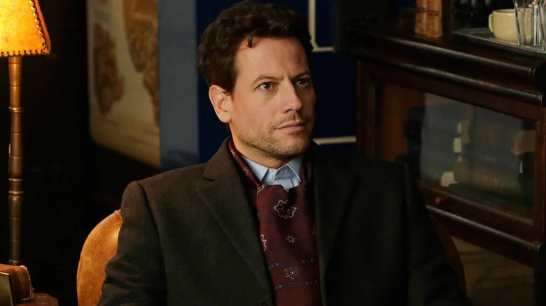 Ioan Gruffudd as Dr. Henry Morgan sits in a chair in Forever