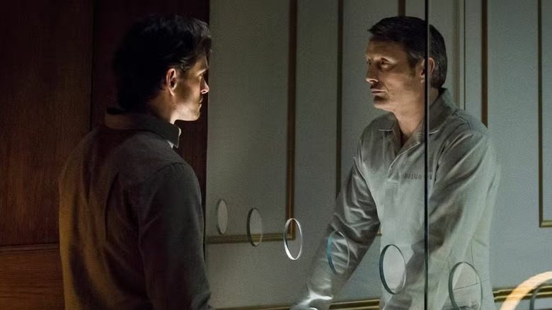 Hugh Dancy as Will Graham stares at Mads Mikkelsen as Hannibal Lecter in Hannibal