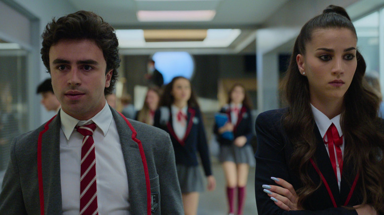 Samuel (Itzan Escamilla) and Rebeka (Claudia Salas) walk the halls in Elite
