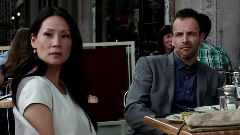 Dr. Joan Watson (Lucy Liu) and Sherlock Holmes (Jonny Lee Miller) stare down a perp in Elementary