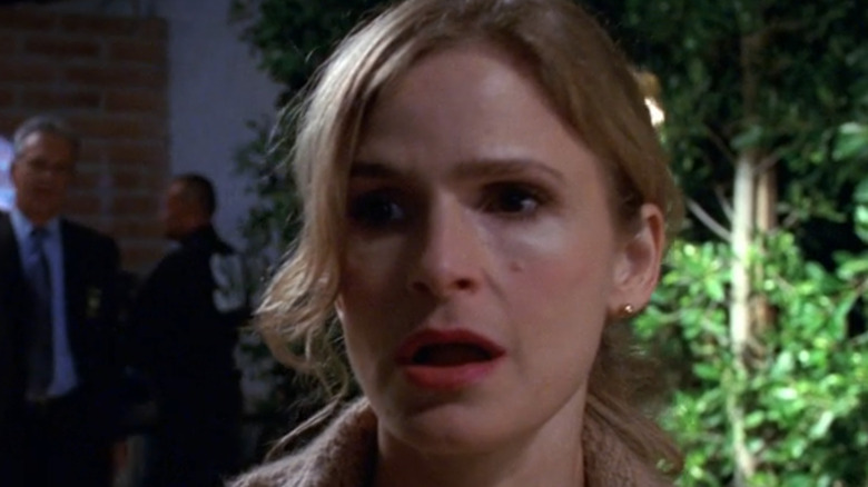 Brenda Leigh Johnson (Kyra Sedgwick) assesses a crime scene in The Closer