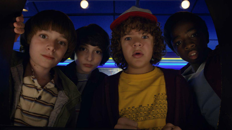 Will Mike Dustin and Lucas looking in wonder at something on Stranger Things