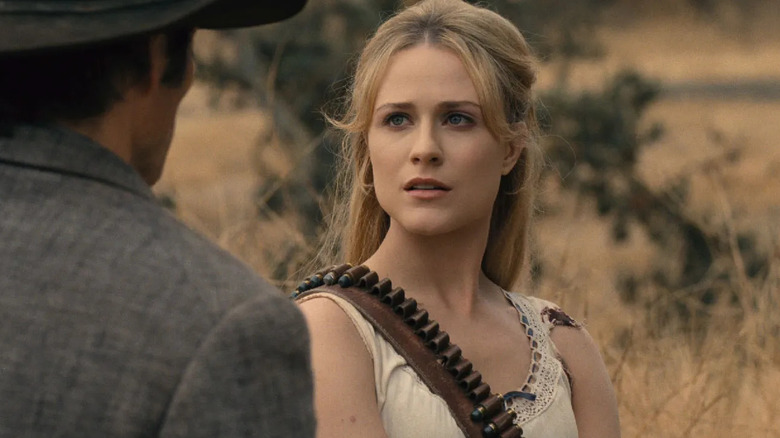 Dolores looking at Teddy with ammunition across her chest on Westworld