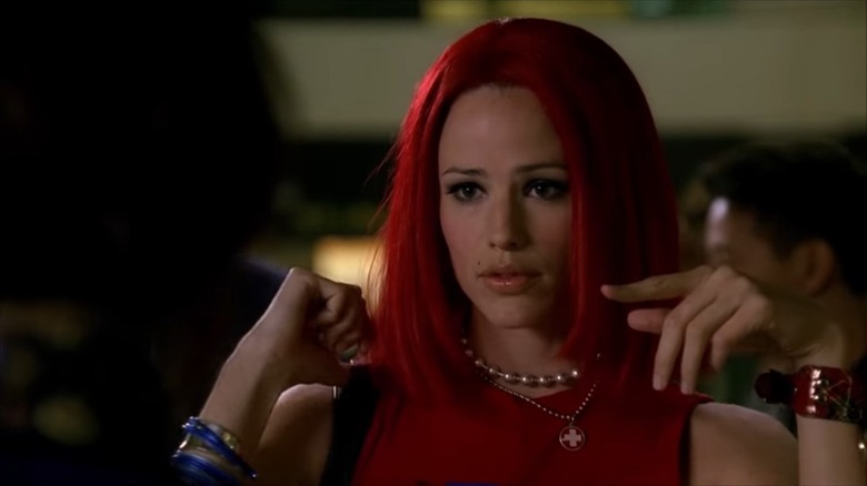 Sydney Bristow (Jennifer Garner) wears a red wig as a disguise in Alias