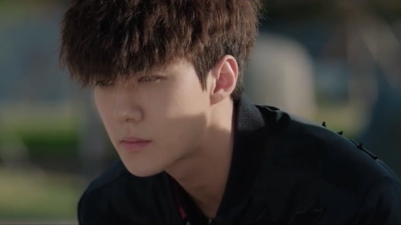 Kang Hyuk (Oh Se-hun) stares moodily on Dokgo Rewind