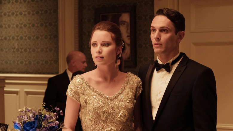 Jenna (Hannah Anderson) and Rick (Colin Woodell) are shocked at a fancy party on The Purge