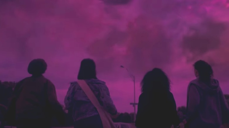 KJ Brandman (Finna Strazza), Erin Tieng (Riley Lai Nelet), Tiff Quilkin (Camryn Jones), and Mac Coyle (Sofia Rosinsky) stare at a purplish pink cloudy sky in Paper Girls
