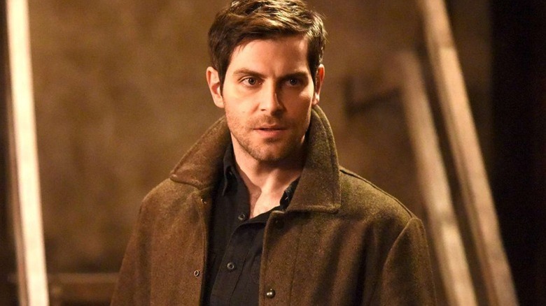 Nick Burkhardt (David Giuntoli) stares intensely by a staircase in Grimm