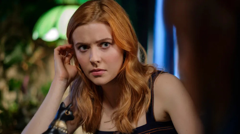 Nancy Drew (Kennedy McMann) inquisitively brushes her hair back in Nancy Drew (2019)