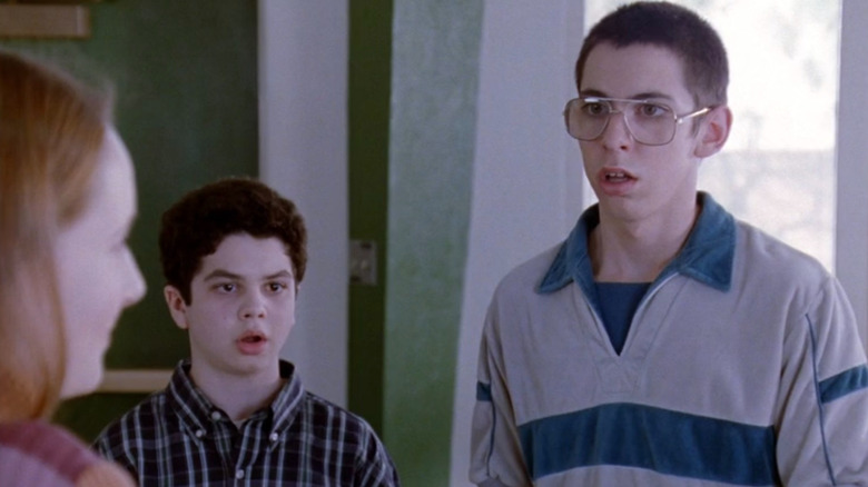 Bill (Martin Starr) and Neal (Samm Levine) looking shocked near a girl on Freaks and Geeks