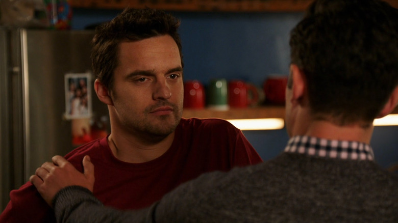 Nick (Jake Johnson) in the kitchen with Schmidt (Max Greenfield) on New Girl