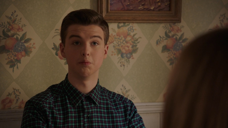 Sheldon (Iain Armitage) sitting at a table on Young Sheldon