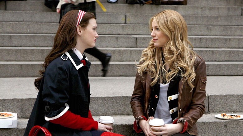 Blair and Serena sitting on steps talking to each other on Gossip Girl