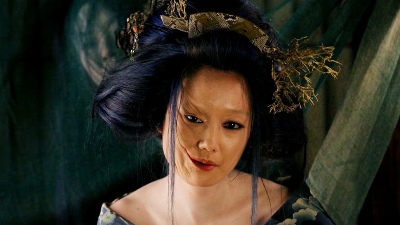 The Madam (Toshie Negishi) stares her guests down in Masters of Horror episode Imprint