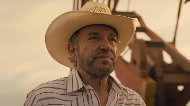 Billy Bob Thornton's Tommy Morris in a cowboy hat and striped shirt on Landman