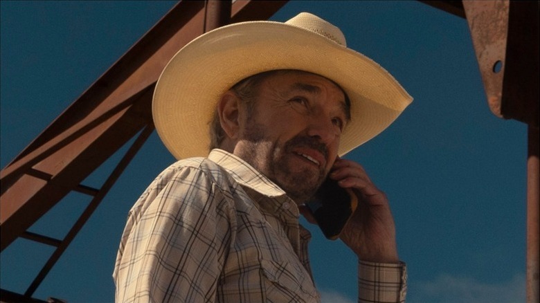 Tommy Norris (Billy Bob Thornton) talks on the phone while standing by an oil drill in Landman
