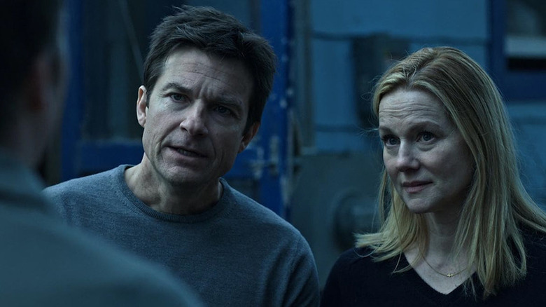 Marty Byrde (Bateman) and Wendy Byrde (Laura Linney) speak to someone outside in Ozark