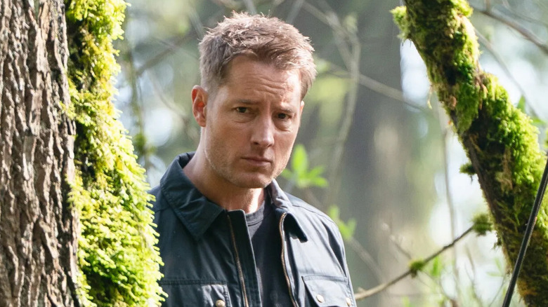Colter Shaw (Justin Hartley) peers through the woods in Tracker
