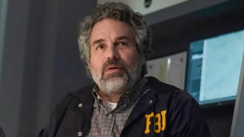 Tom Brandis with beard in FBI windbreaker in Task