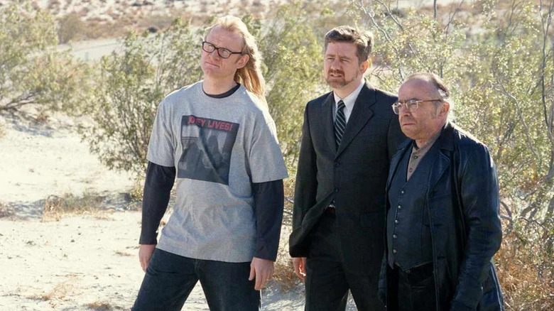Dean Haglund as Langly, Bruce Harwood as Byers, and Tom Braidwood as Frohike, outdoors in the desert in an episode of The Lone Gunmen