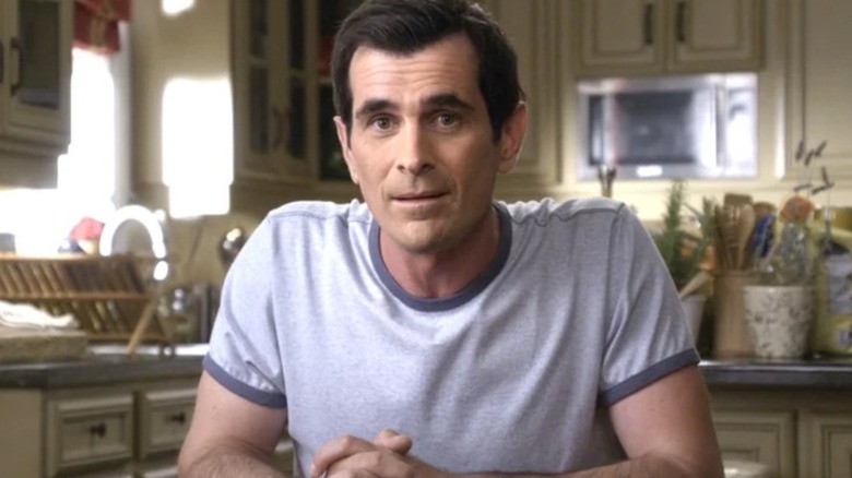 Phil Dunphy (Ty Burrell) speaks to the camera in the kitchen in Modern Family