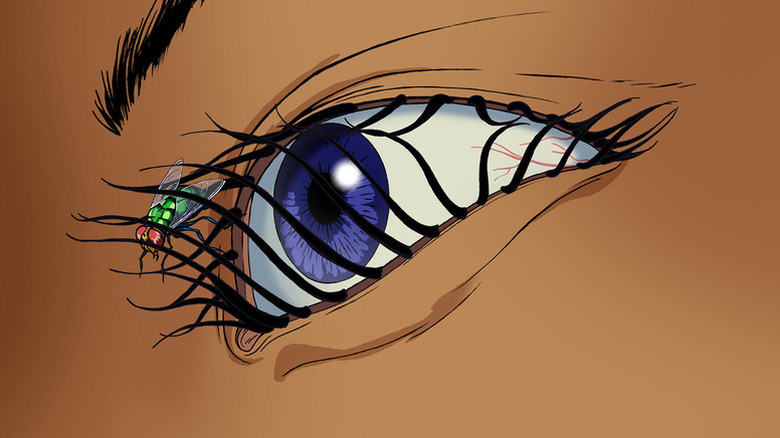A fly crawls by a human eye in Æon Flux
