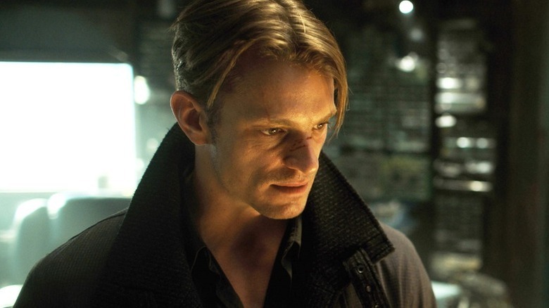 Takeshi Kovacs (Joel Kinnaman) stares downward in Altered Carbon