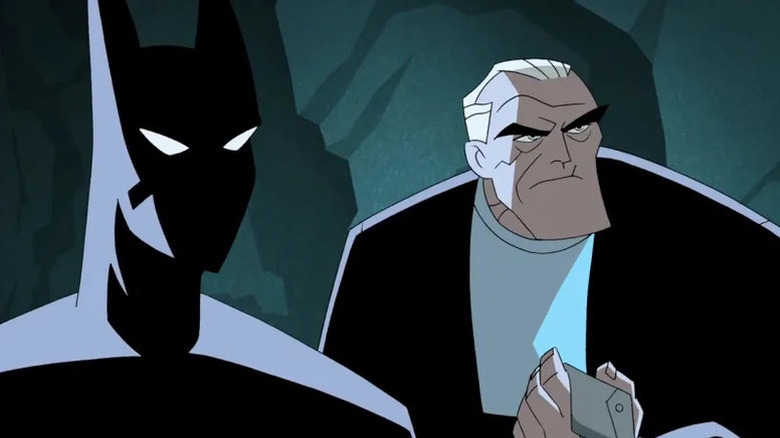 Terry McGinnis (Will Friedle) stands in the Batsuit next to Bruce Wayne (Kevin Conroy) in Batman Beyond