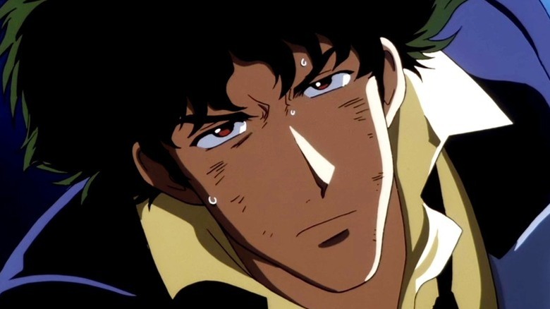 A dirty and sweaty Spike Spiegel looks up in Cowboy Bebop (1998)