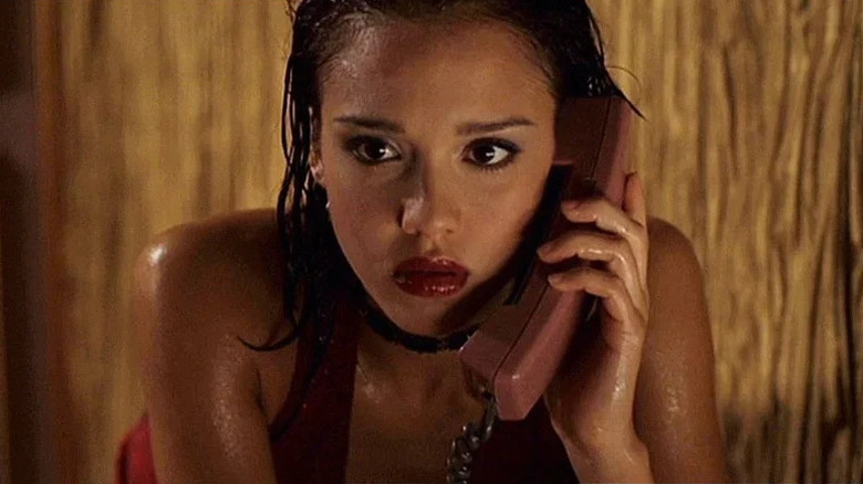 A wet Max Guevara (Jessica Alba) answers a phone in Dark Angel