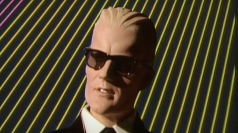 Max Headroom (Matt Frewer) speaks during a broadcast in Max Headroom