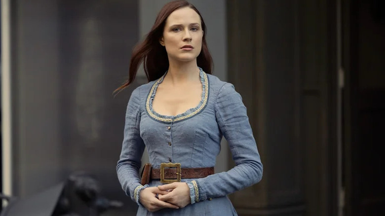 Dolores Abernathy (Evan Rachel Wood) stands inquisitively in Westworld
