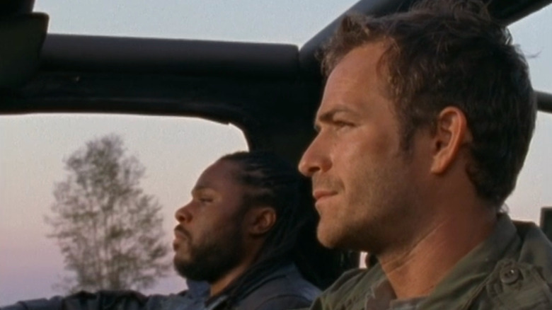 Jeremiah in car next to Kurdy, driving