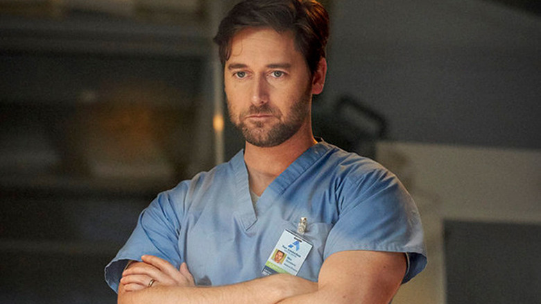 Ryan Eggold as Max wearing blue hospital scrubs in "New Amsterdam."