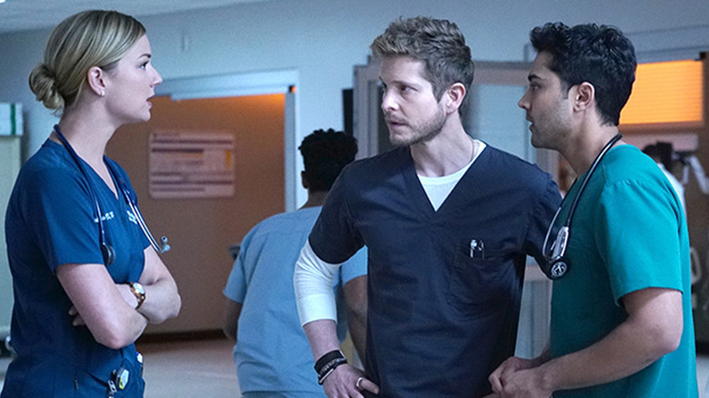 Emily VanCamp as Nic, Matt Czuchry as Conrad, and Manish Dayal as Devon in "The Resident."