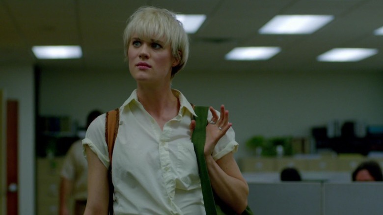 Cameron Howe standing in the office and holding the strap of her bag on Halt and Catch Fire S1E5