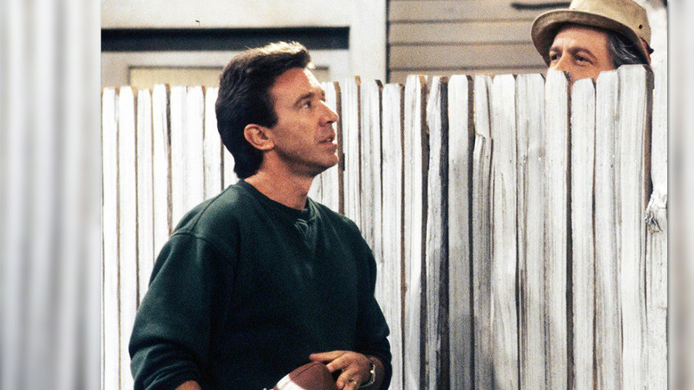 Tim Allen, as Tim Taylor, gets sage advice from Wilson (Earl Hindman) on "Home Improvement."