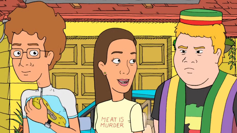 Gerald and Helen with a disgruntled Ubuntu on "The Goode Family."