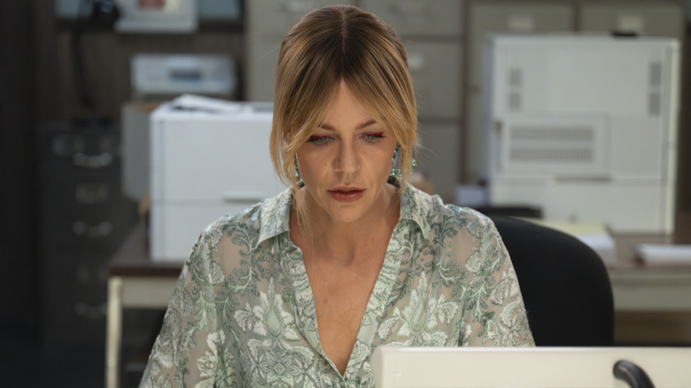 Kaitlin Olson as Morgan Gillory working at her desk in High Potential