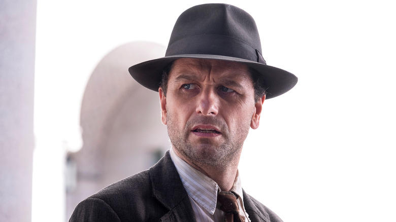 Matthew Rhys in suit and hat as Perry Mason in Perry Mason