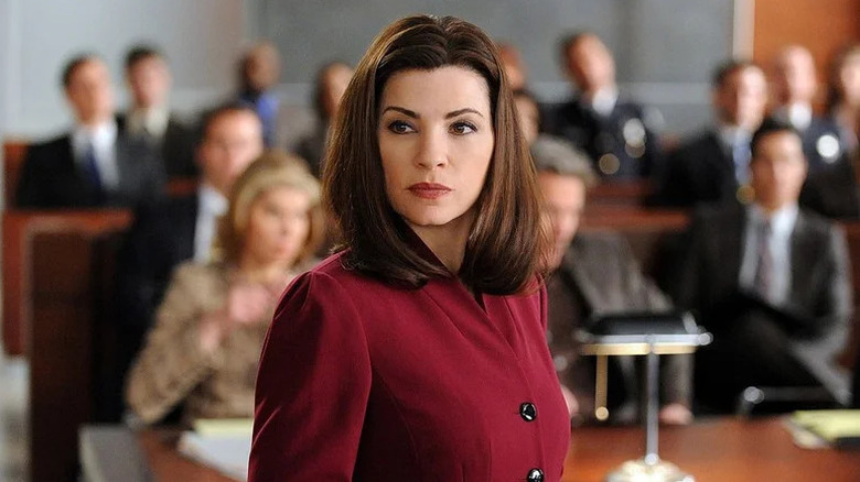 Julianna Margulies as Alicia Florrick in red standing in courtroom in The Good Wife