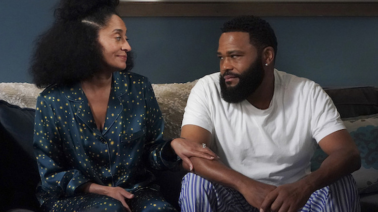 Rainbow touches Andre's arm in "Black-ish"