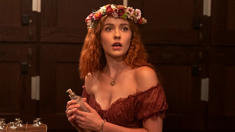 Kennedy McMann as Nancy in dress and flower crown in Nancy Drew