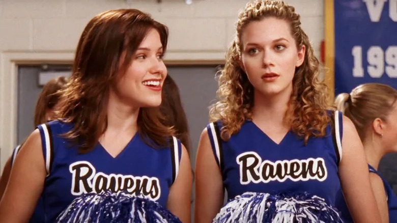 Sophia Bush as Brooke and Hilarie Burton as Peyton wearing blue cheerleading uniforms in One Tree Hill