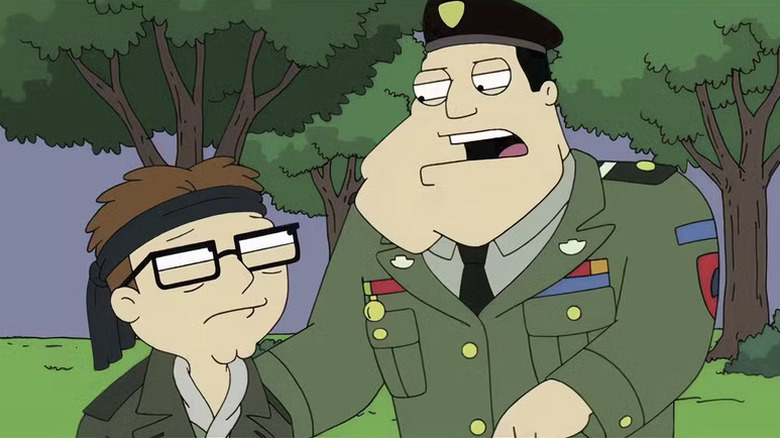 Steve Smith, wearing a bandana, glances up at Stan Smith