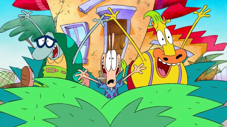 Filburt, Rocko Rama, and Heffer Wolfe cheer in front of a house in Rocko's Modern Life