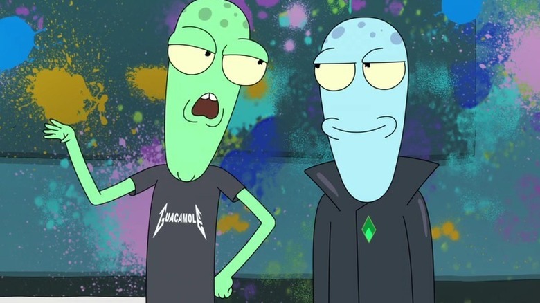 Korvo and Terry stand next to each other by a painted wall in Solar Opposites