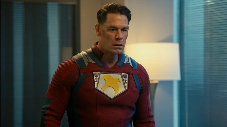 Chris Smith stands stunned in an office